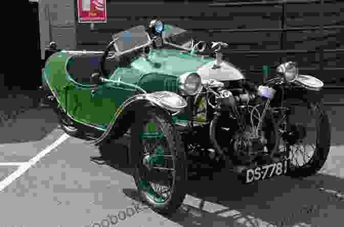 A Color Photograph Of A Morgan Three Wheeler From The 1930s, Showcasing Its Sleek Bodywork, Streamlined Fenders, And Enclosed Cockpit. Completely Morgan: Three Wheelers 1910 1952