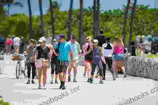 A Couple Walking Along Ocean Drive In Miami How Much I Love: Miami Nights