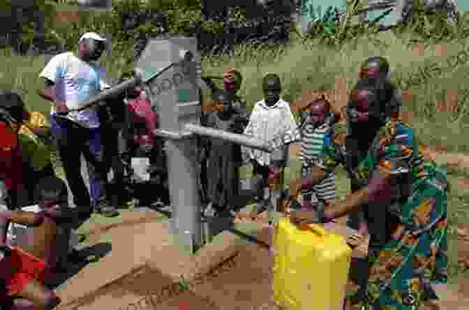 A Group Of People Standing Around A Newly Installed Water Pump In Rural Uganda Water Is Life: Progress To Secure Water Provision In Rural Uganda