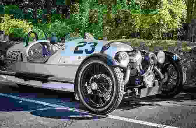 A Vintage Black And White Photograph Of The First Morgan Three Wheeler From 1910, Showcasing Its Distinctive Three Wheeled Design And Open Cockpit. Completely Morgan: Three Wheelers 1910 1952