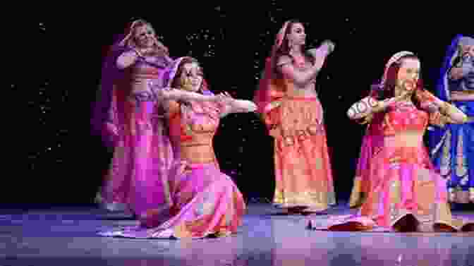 Bollywood Dance Performance, A Group Of Dancers Performing A Traditional Bollywood Dance, With Colorful Costumes And Energetic Movements Meet Me In Bombay Jenny Ashcroft