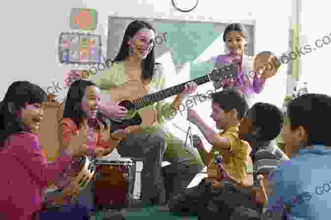 Jerry Young Teaching A Group Of Children How To Play Music Triple A 7 Jerry D Young